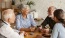 a group of people sitting around a table