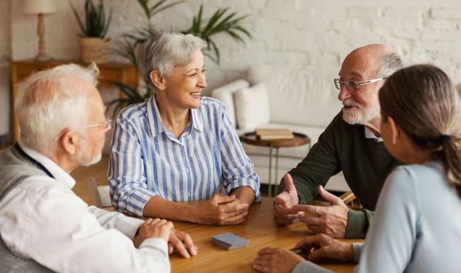 a group of people sitting around a table